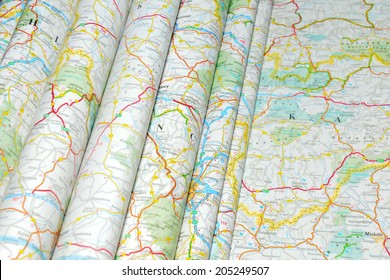 Various colorful road maps folded