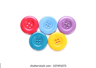 Various colorful sewing buttons on white background