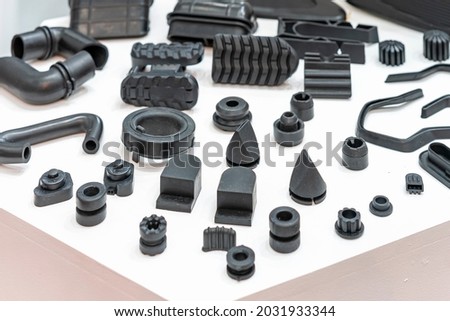 Various compression molded rubber sample parts made from manufacturing process in industrial e.g. plug cover cap pipe tube pedal nozzle connector and automobile parts other