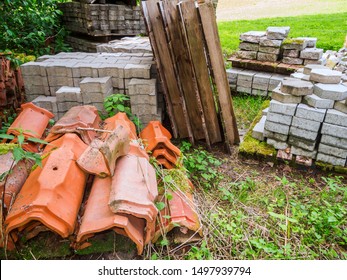 Various Construction Materials For Building A House In A Meadow Along The Way.