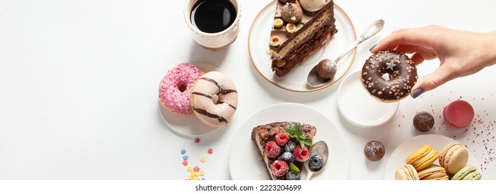 Various cookies, donuts, cakes, cheesecakes and coffee cups on white background.  Delicious dessert table. Top view, flat lay, panorama, banner - Shutterstock ID 2223204699