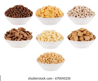 Various corn flakes in white bowls - rings, stars, balls, chocolate, pads; isolated on white background. Cereals collection.