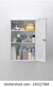 Various Cosmetics And Bath Products In Bathroom Cabinet