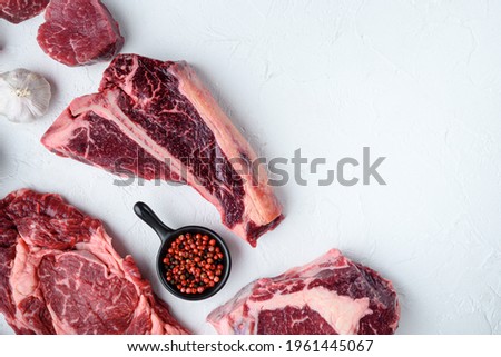 Dry aged raw tomahawk beef steak isolated on white background