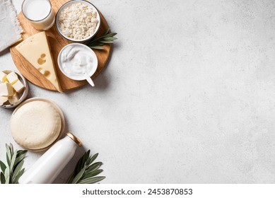 Various dairy products. Milk, cheese, cottage, sour cream, butter on white background, top view, copy space. Organic food,  Jewish Shavuot holiday breakfast. - Powered by Shutterstock