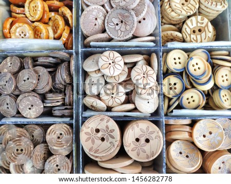 Various design and pattern of buttons in the box set.