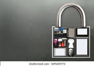Various devices including tablets, computer mouse, usb cards in the shape of a padlock on a chalkboard background