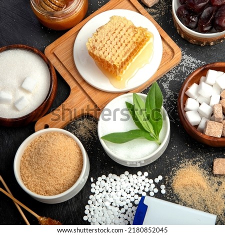 Various diet replacement for sugar on dark background. Organic sweetener concept. Top view, flat lay