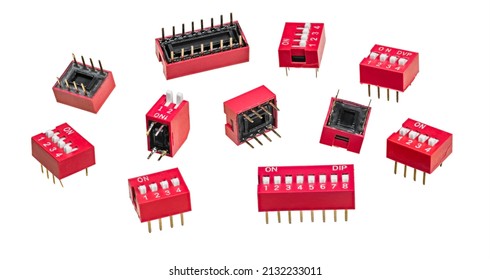 Various DIP switch set for PCB isolated on white background. Group of slide-style or piano-style manual electric switches in red dual in-line package with plastic input contacts and metal output pins.