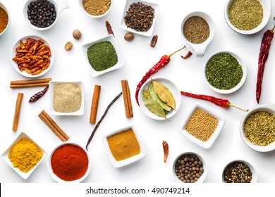 Various Dried Herbs And Spices Isolated On White Background.