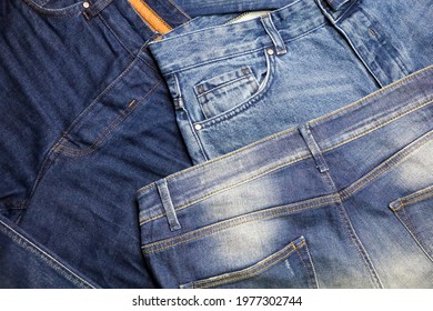 Various Factory Blue Jeans. Denim Textile Background