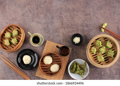 Various Flat Lay Chinese Food, Dim Sum on Bamboo Steamer Above Marble Top