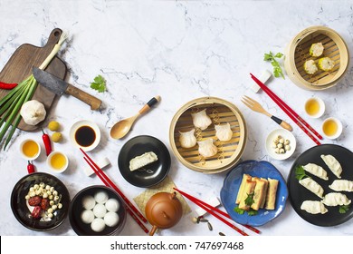 Various Flat Lay Chinese Food, Dim Sum And Tea On Marble Top.