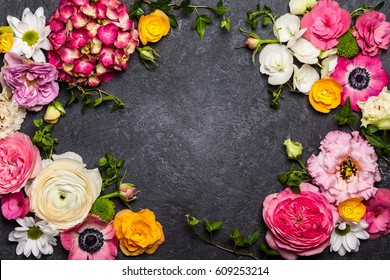 Various Flowers On Black Background. Overhead View With Copy Space