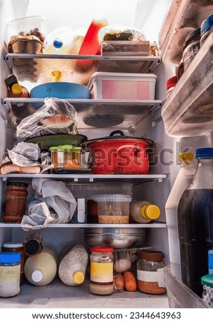 Various food items going rotten inside a dity refrigerator