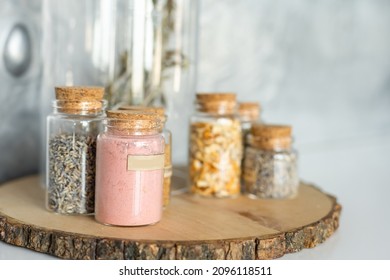 Various Food Supplies Including Grains, Condiments, Tomato Sauce, Oil In Glass Bottles And Jars, Dry Pasta, Canned Produce On Kitchen Table. Sustainability Concept. Horizontal Orientation