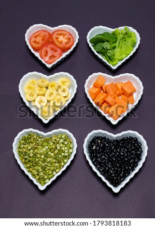 Various foods in heart-shaped bowls