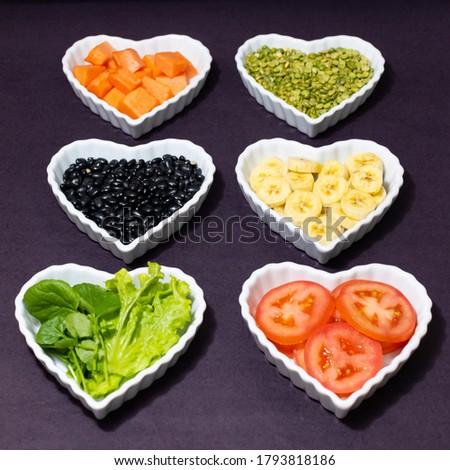 Various foods in heart-shaped bowls