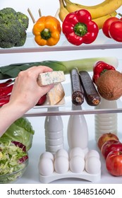 Various Foods In The Refrigerator, Eggs, Dairy Products. Fridge Frozen Ingredient Meal Nature Nutrition Broccoli,  Hands Healthy Eating.