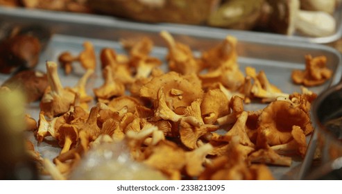 Various forest mushrooms are washed and ready to be sliced in the process of preparing delicious mushroom dishes. Healthy and vegetarian food.