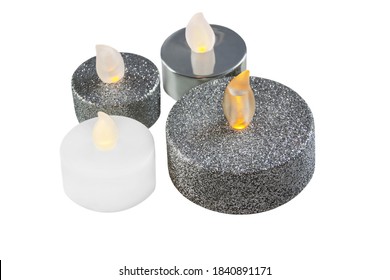 Various four LED candles close up isolated against white background - Powered by Shutterstock