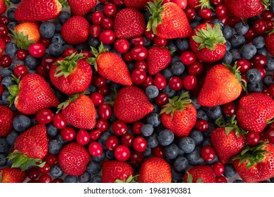 Various fresh forest berries on white background. Organic food concept. Top view