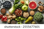 various fresh healthy products on grey table, top view. Healthy food clean eating selection: fruit, vegetable, seeds, superfood, cereals, leaf vegetable on gray concrete background