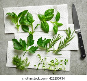 Various Fresh Herbs On Paper Towel, Top View