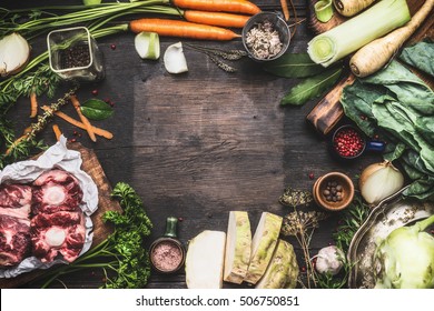 Various Fresh Organic Ingredients For Broth Or Soup Cooking With Vegetables And Meat On Dark Wooden Background, Top View, Frame