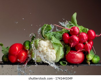 Various Fresh Raw Vegetables With Water Splash. Copy Space.