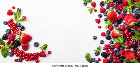 Various fresh summer berries. Top view - Shutterstock ID 609420503