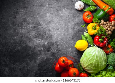 Various fresh vegetables organic food for healthy on dark rustic background with copy space for your text.
