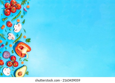 Various fresh vegetables pattern. Raw organic vegetables, salad ingredients bright flatlay on vibrant blue background. Healthy diet common diet, vegan vegetarian food cooking background copy space - Powered by Shutterstock