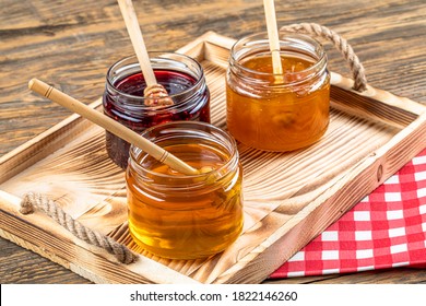 Various fruit marmalade jams in jars top view. Honey, apricot jam and strawberry jam in jars. - Powered by Shutterstock