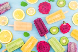 Various Fruit Popsicles Are Placed On The Blue Wooden Board Background, Kiwi Popsicles, Orange Popsicles, Dragon Fruit Popsicles, Cantaloupe Popsicle