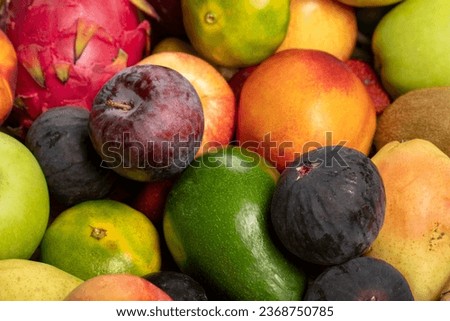 Various fruits colorful, clean eating, Fruit background. Fresh fruits. Grape, Fig, Strawberry, apple, pear, kiwi, peach