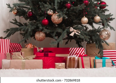 Various Gifts Under Beautiful Christmas Tree