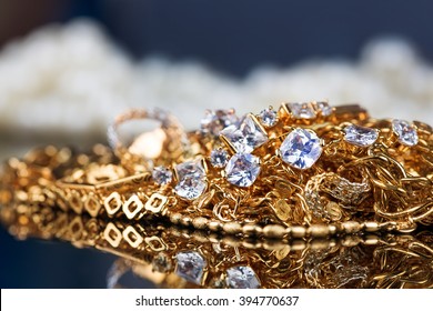 Various Gold Jewellery On Black Background