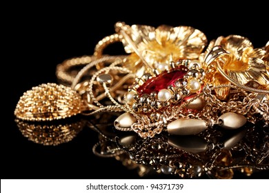 Various Gold Jewellery On Black Background