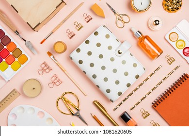 Various Golden, Orange And White Stationary And Office Tools And Accessories Knolled Together On Pastel Background: Planner, Brushes, Pencils, Clips, Rulers, Scissors, Etc. Flatlay