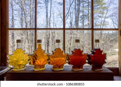 Various Grades Of Delicious Vermont Maple Syrup Lined Up On A Windowsill