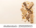 Various granola bars on table background. Cereal granola bars. Superfood breakfast bars with oats, nuts and berries, close up. Superfood concept.