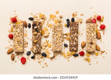 Various granola bars on table background. Cereal granola bars. Superfood breakfast bars with oats, nuts and berries, close up. Superfood concept. 庫存照片