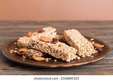 Various granola bars on table background. Cereal granola bars. Superfood breakfast bars with oats, nuts and berries, close up. Superfood concept. - Powered by Shutterstock