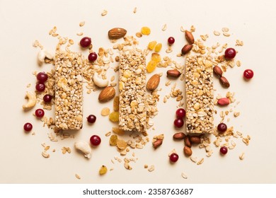 Various granola bars on table background. Cereal granola bars. Superfood breakfast bars with oats, nuts and berries, close up. Superfood concept. - Powered by Shutterstock