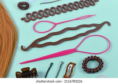 Various hair styling tools like bun maker, braid tool, ponytail style maker, hair clip, rubber bands and pins 
