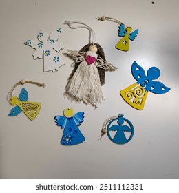 various handmade angels on the table