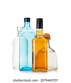 Various Hard Liquor Bottles. Gin, Vodka, Tequila And Whiskey. Isolated On White Background