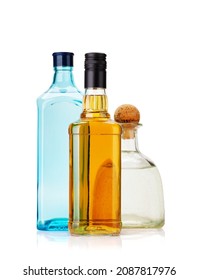 Various Hard Liquor Bottles. Gin, Vodka, Tequila And Whiskey. Isolated On White Background