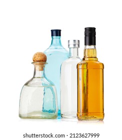 Various Hard Liquor Bottles. Gin, Vodka, Tequila And Whiskey. Isolated On White Background